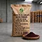 X-HUMATE 20kg EDDHA Fe 6% chelated iron fertilizer micro granular in eco-friendly kraft paper bag, featured with dark red powder in a wooden bowl on warehouse background.